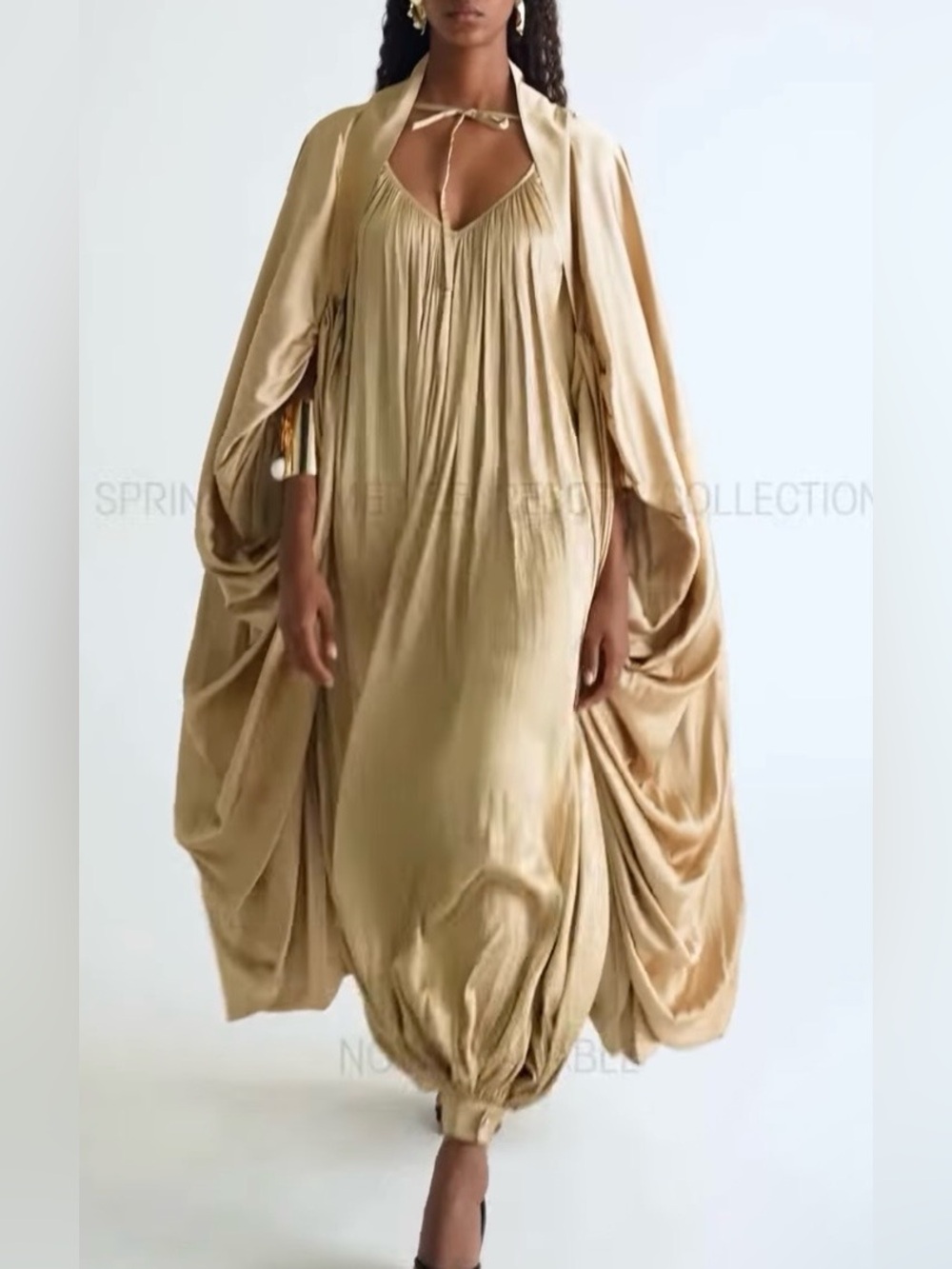 ultra-luxurious champagne-gold satin statement cape